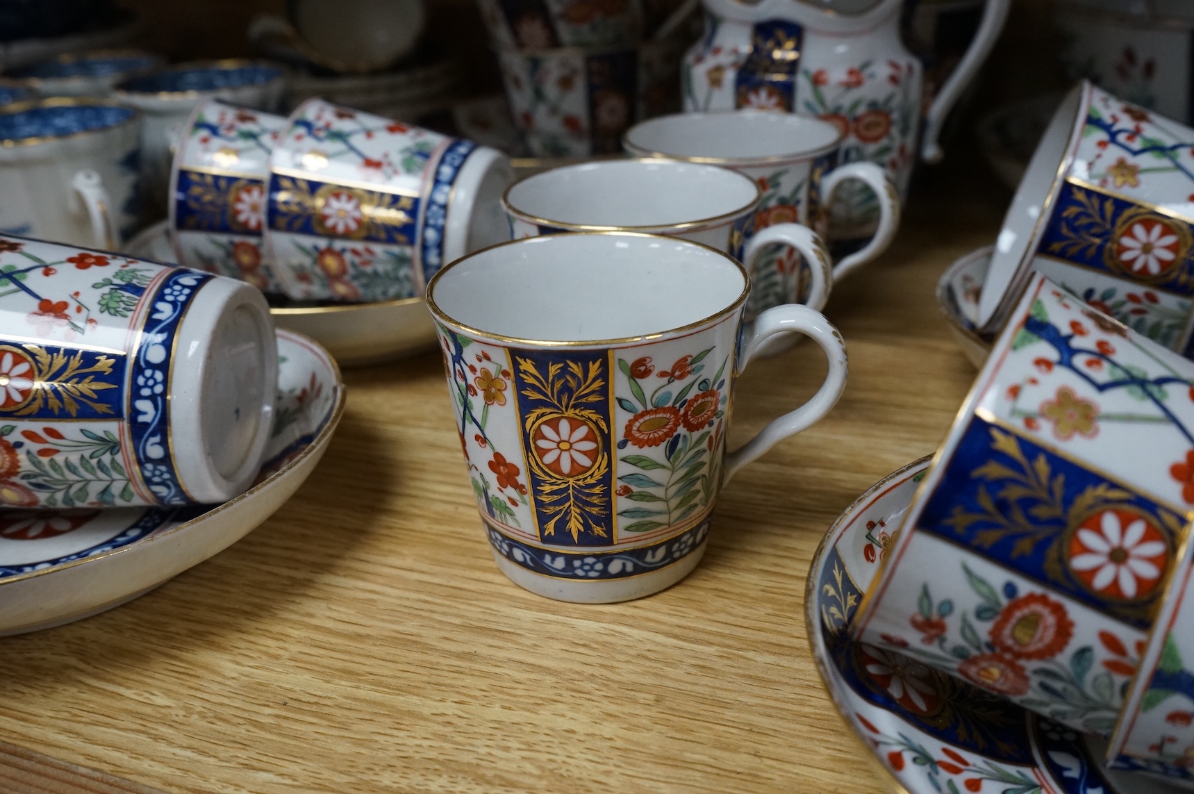 A group of late 18th century Worcester kakiemon pattern tea and coffee wares together with Worcester and Caughley Willow type pattern blue and white coffee ware